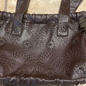 Brown Embossed Leather Shoulder Bag with Metallic Snap & Drawstring Closure